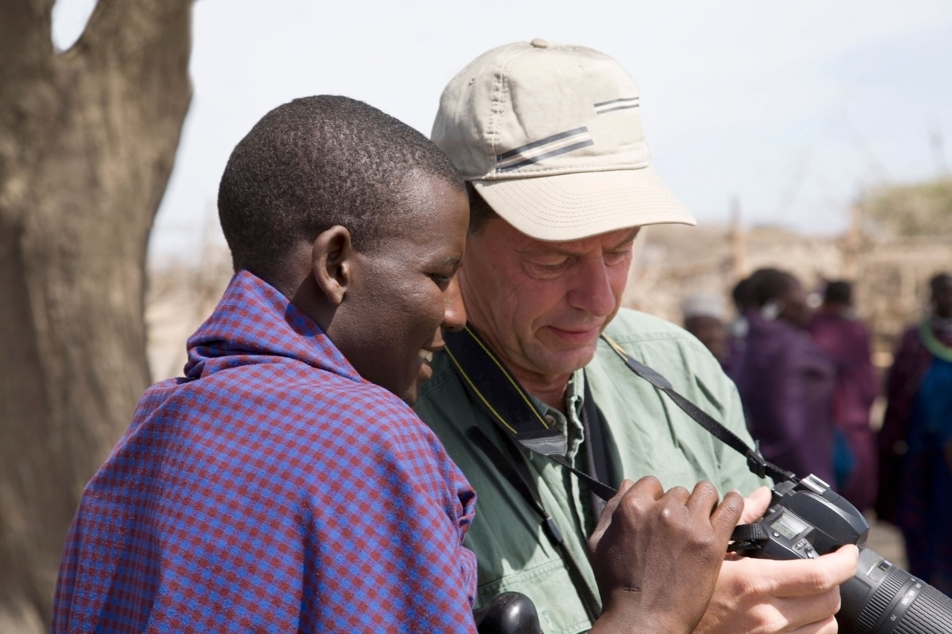 Young maasai and tourist.